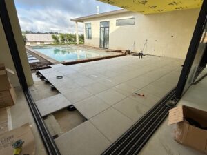 concrete patio overlay with porcelain pavers and adjustable pedestals